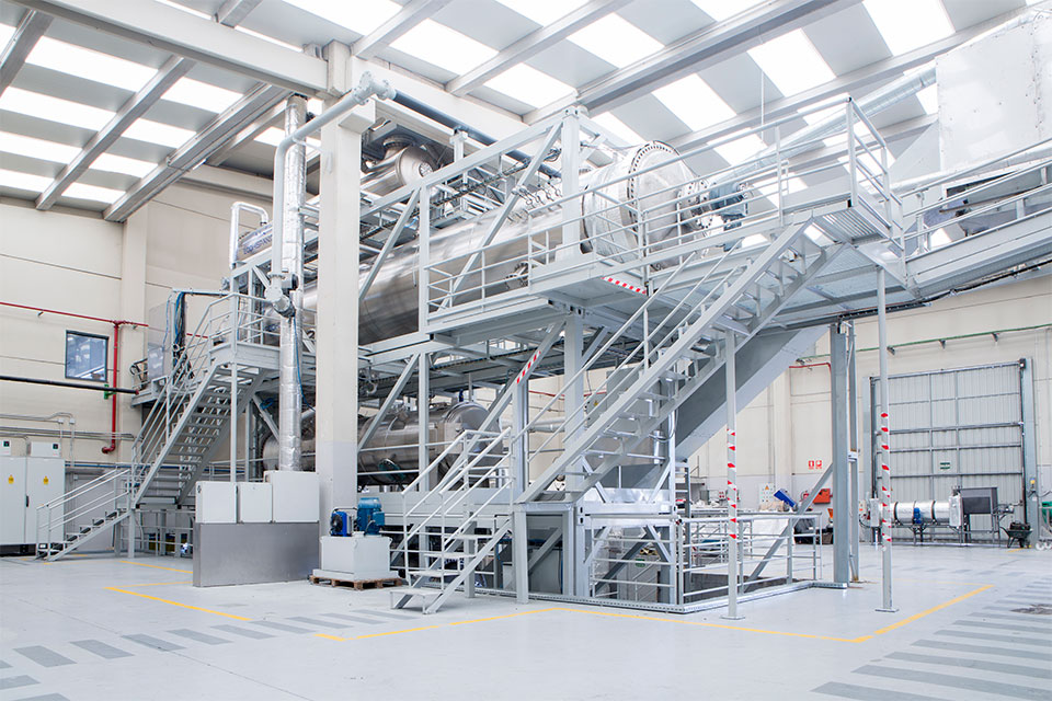 Wide angle view of a 2 storey machine inside a warehouse.